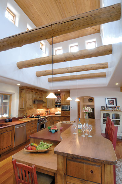 Fireslate counters made from concrete with recycled content; cabinets built from local, sustainably harvested pine; and sustainable cherry wood floors lend a warm, rustic feel to the kitchen.